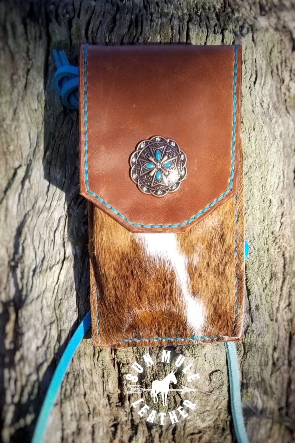 Phone holder pouch for saddle or belt with copper cross concho