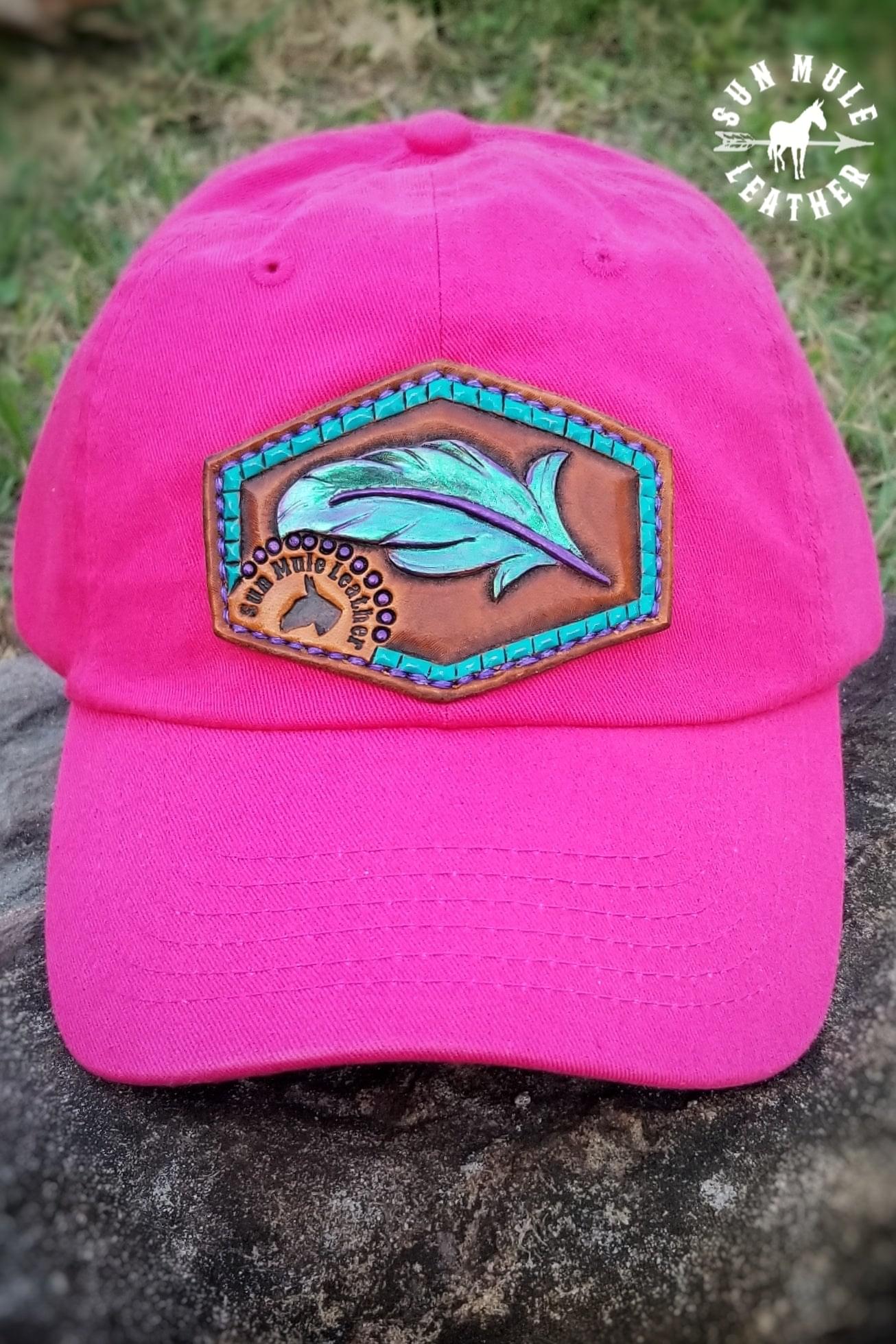 Hand tooled leather hat patch with purple/mermaid colored paint. 