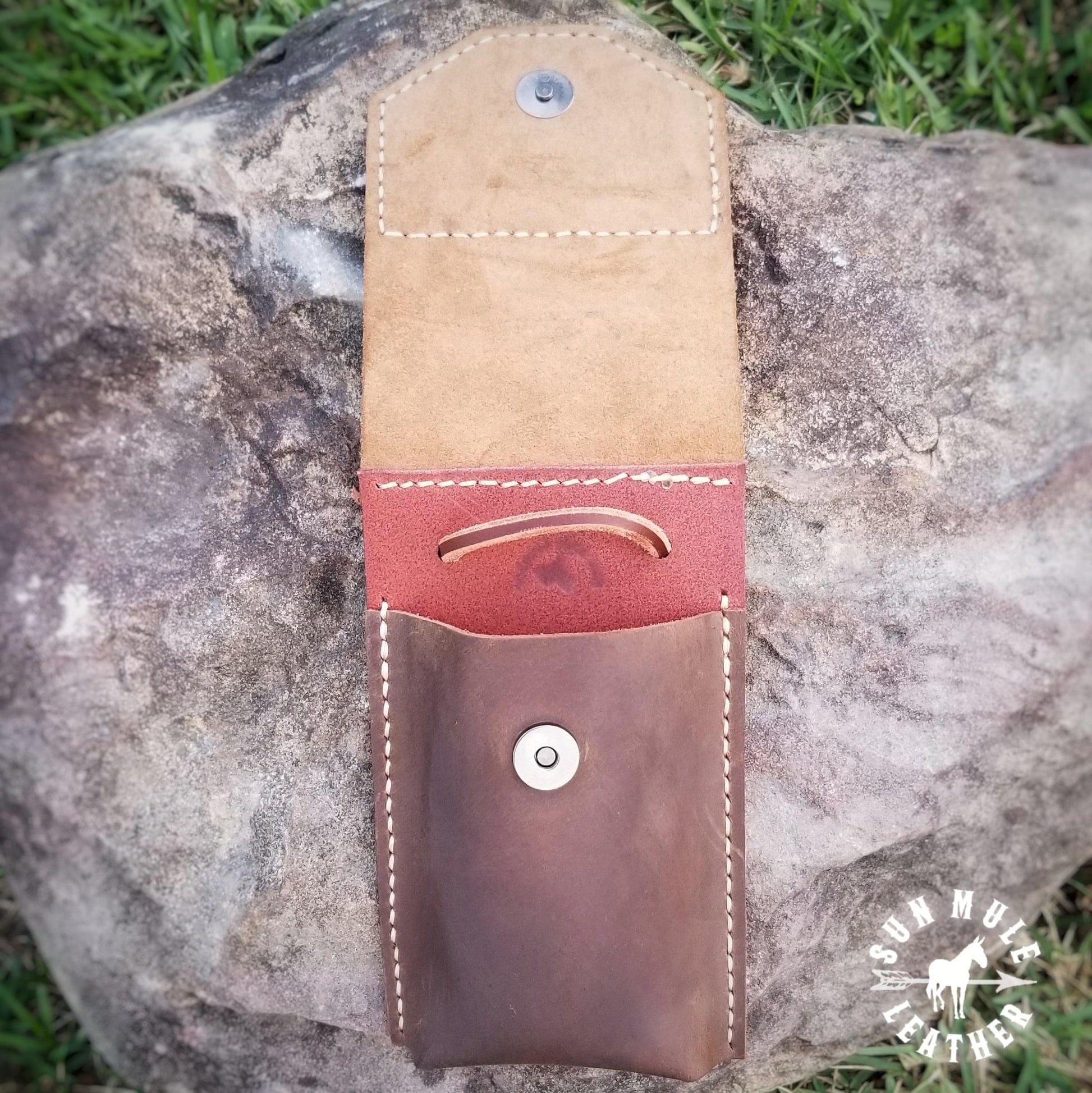 inside view of Phone holder pouch for saddle or belt with hand tooled sunflower