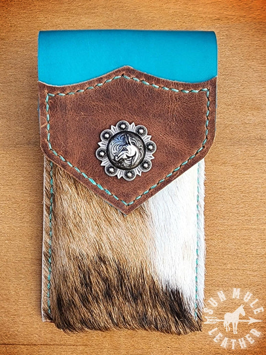 Phone holder pouch for saddle or belt with a mule concho. 