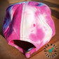 back view of Tie-dyed mule hat with hand tooled leather mule patch.